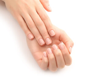 Well-groomed hands and nails in the winter cold